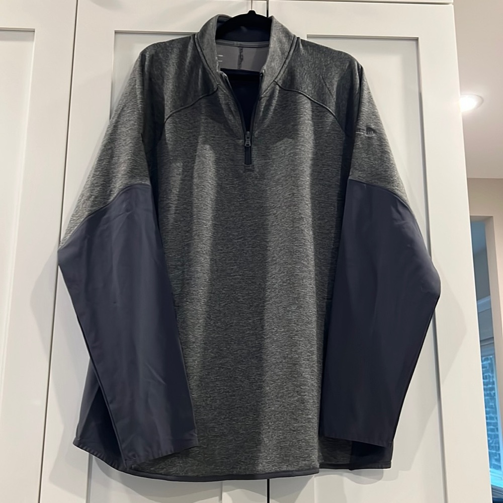 Never worn! Men’s 2XL Under Armour quarter zip pullover. Wind breaker back.